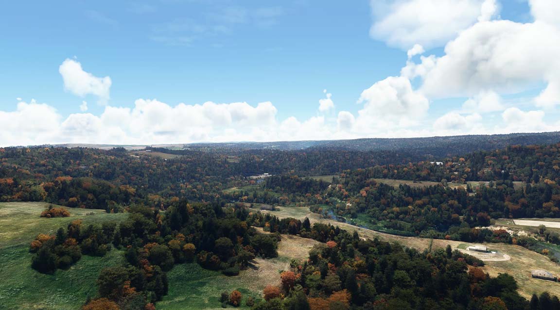A scenic view of autumn mountains and trees.
