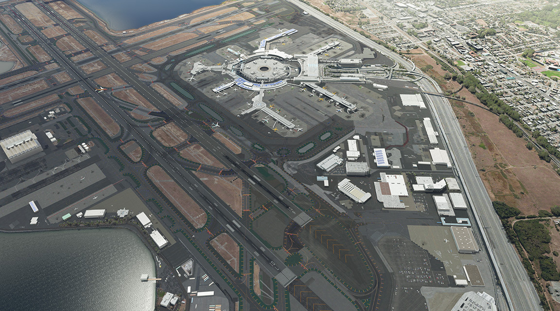 Aerial view of a bustling airport with a central terminal building surrounded by runways and parked airplanes.