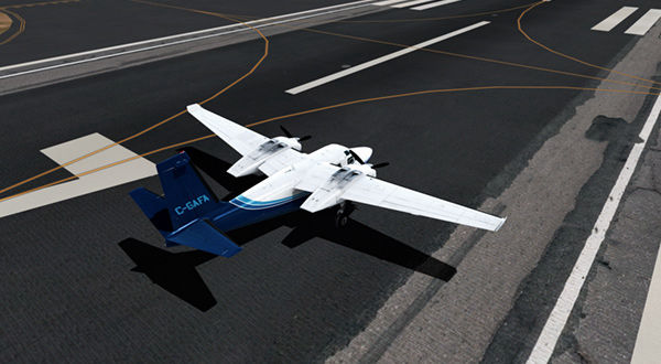 Small airplane parked on airport runway.
