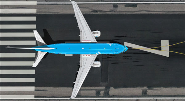 Aircraft with blue color parked on the runway.