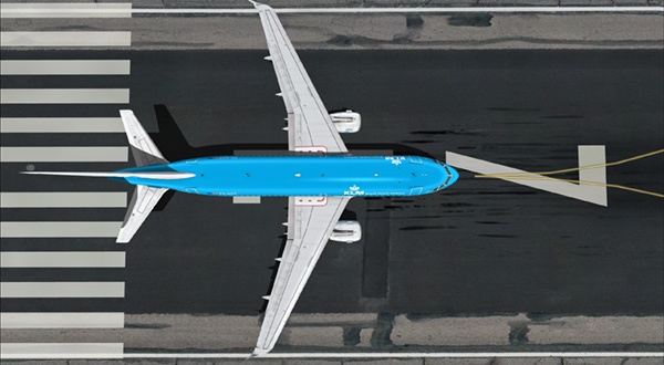 Aircraft with blue color parked on the runway.