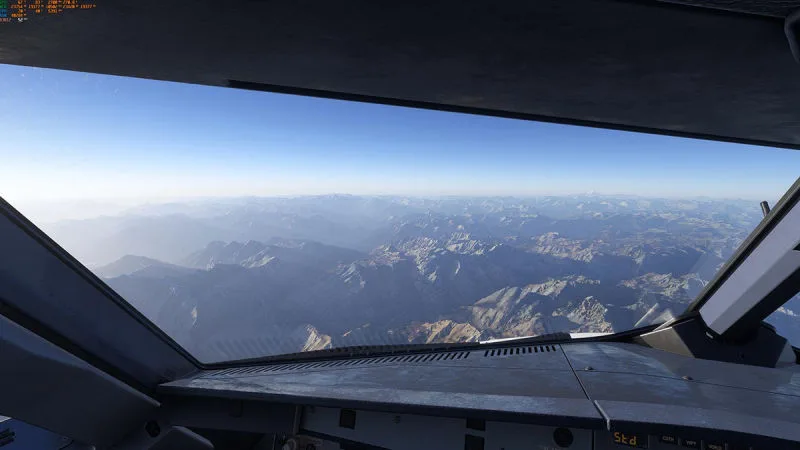 Airliner cockpit view over rugged mountain ranges, REX Atmos CORE in Microsoft Flight Simulator 2024
