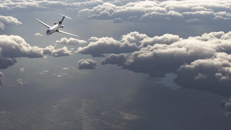 Twin-jet airliner descending above clouds over a lake, REX Atmos CORE in Microsoft Flight Simulator 2024