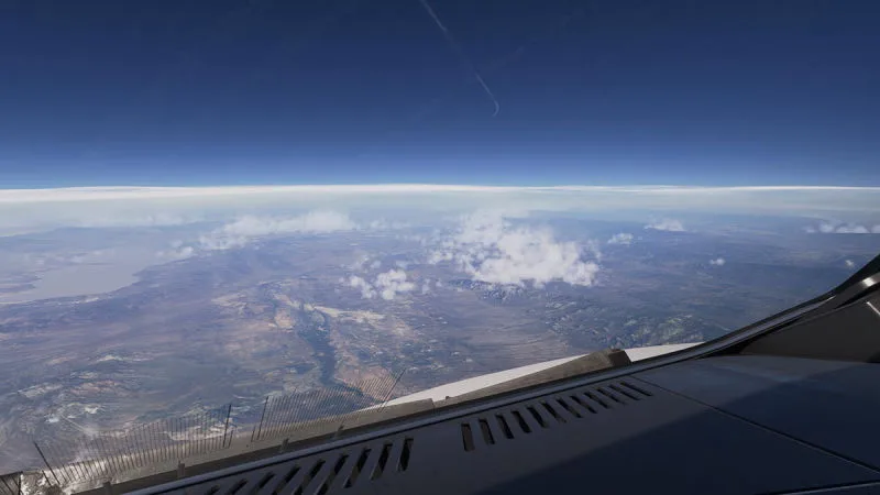 High-altitude view over the wing showing atmospheric haze and the curvature of the Earth, REX Atmos CORE in Microsoft Flight Simulator 2024