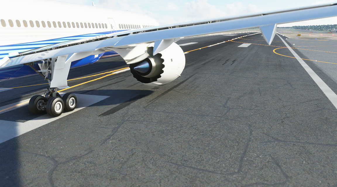 A large airplane with landing gear down on the runway.