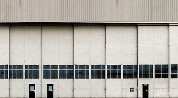 A white dirty airport hangar.
