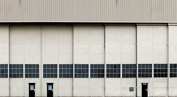 A white dirty airport hangar.