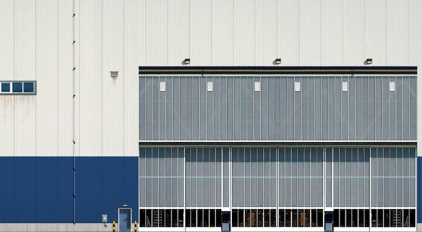 An airport hangar with a large door.