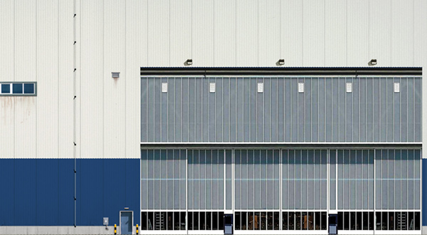 An airport hangar with a large door.