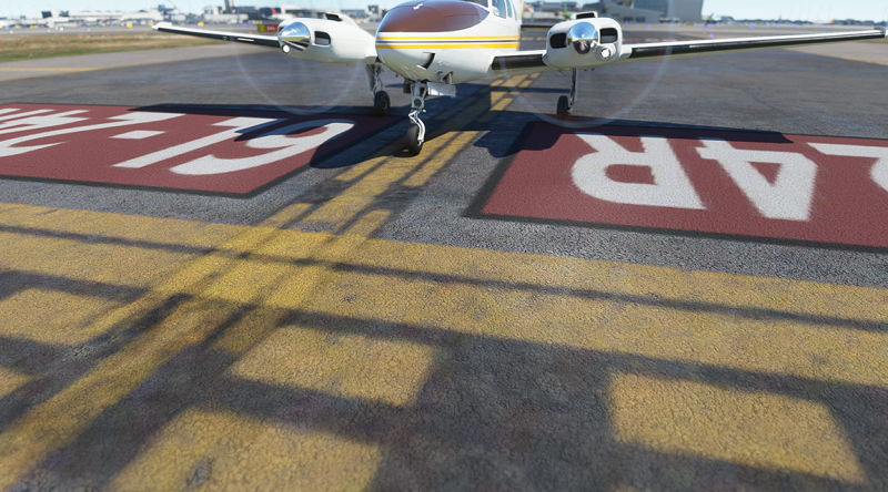 Old and worn taxiway markings.