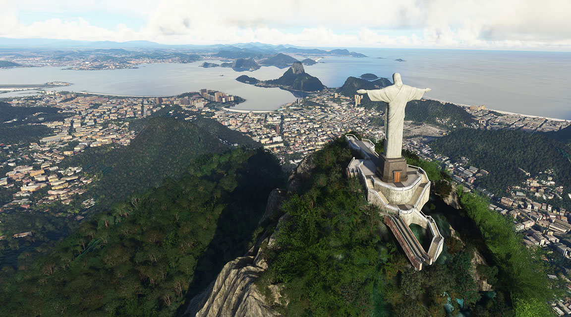 Statue of Christ overlooking Rio de Janeiro from atop a mountain.