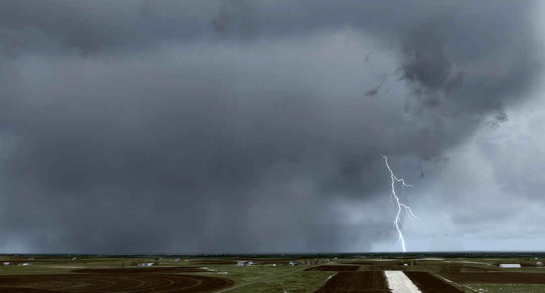 Storm clouds gathering over a field with a lightning bolt striking down.