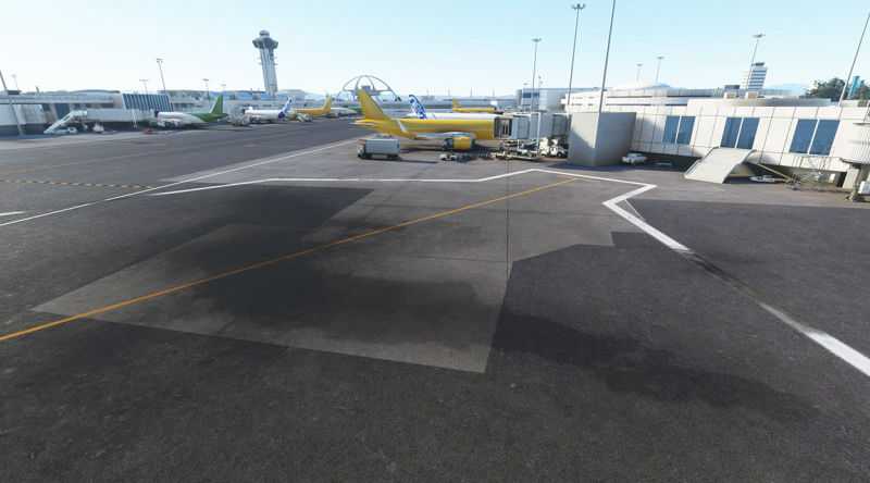 An airplane parked at an airport terminal, ready for boarding.
