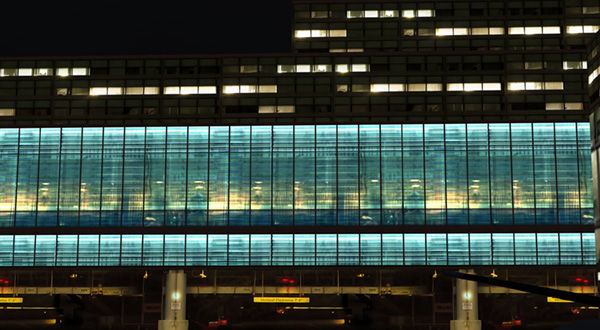 A large airport terminal building with rows of windows.