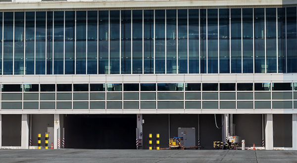 A massive building serving as an airport terminal.