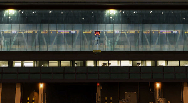 Lit up terminal building at an airport.
