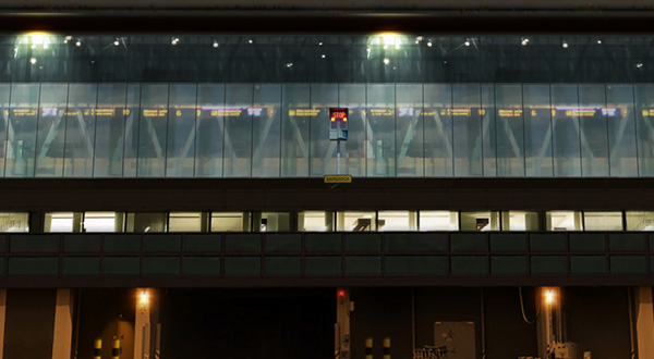 Lit up terminal building at an airport.