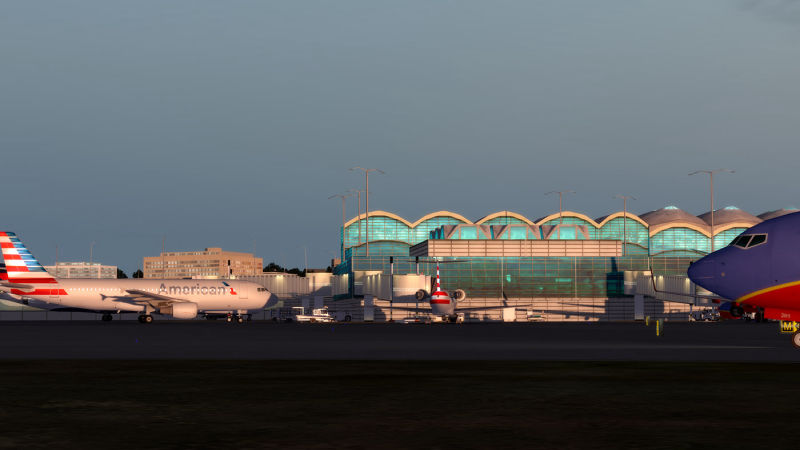 Image of a commercial aircraft on the tarmac at an airport.