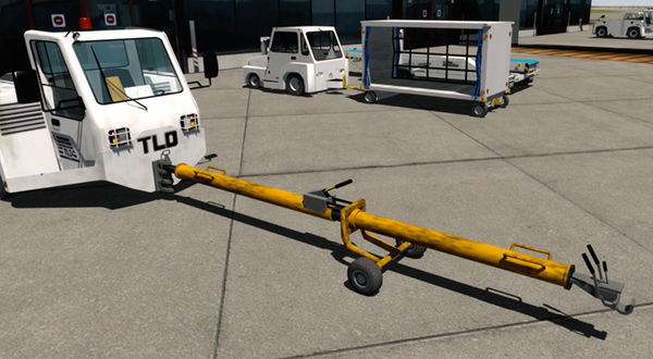Airport pushback vehicle with tow bar, featuring 'TLD' branding.
