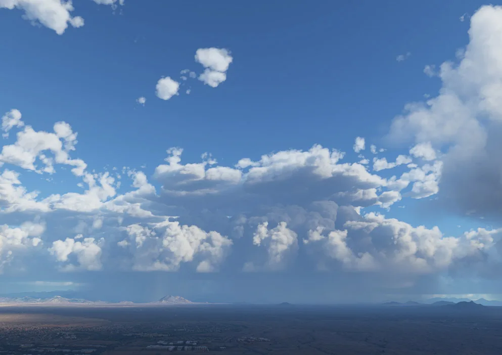 Towering cumulus with rain shafts over a desert landscape, simulated by REX Weather Force